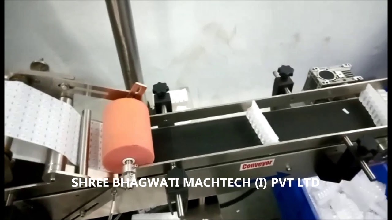 Top Side Sticker Labeling Machine for WFI group injection - YouTube