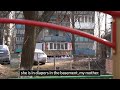Ukrainian grandmother cries at the sight of her daughter's destroyed apartment building