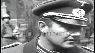German and US officers at surrender proceedings in a town square in Regensburg, G...HD Stock Footage