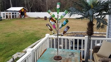 Glass bottle tree scrap metal art