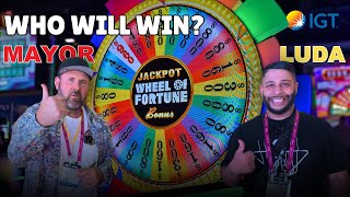 NEW GAME! The Mayor vs. Luda on IGT's NEW Wheel of Fortune Game at G2E 2024 | Jackpot Slot Spot