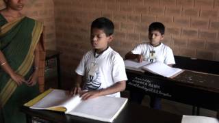 Mathru School for the Blind: Boy reading Braille