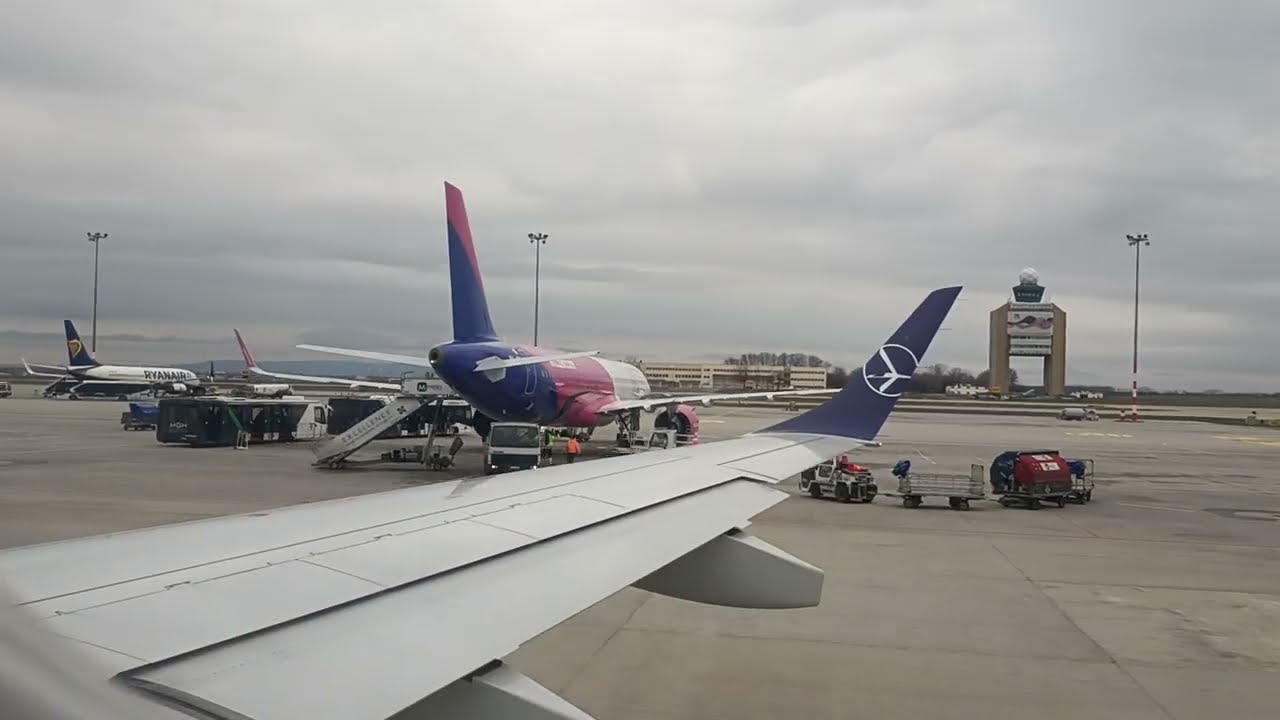 LOT - take off from Budapest to Warszaw - Embraer 195 - passenger view