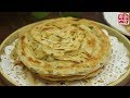 Baked Scallion Pancake。烫面葱香手抓饼，层如薄纸，面丝千连，外层金黄酥脆，内层柔软白嫩，入口松软，外酥里嫩。