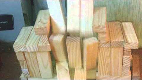 Jenga building collapsing in slow motion