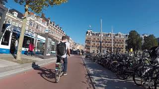 An American guiding you through Amsterdam on a Rental Bike