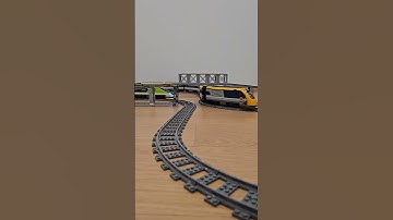 Two LEGO trains rushing on bridge and underbridge loops