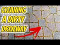 Pressure washing a dirty driveway