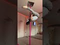 Person is showing off their pole dancing skills!