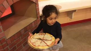 Little girl drops pizza