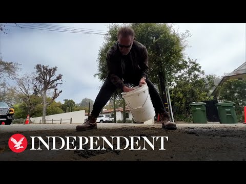 Arnold Schwarzenegger patches up giant pothole in his neighbourhood