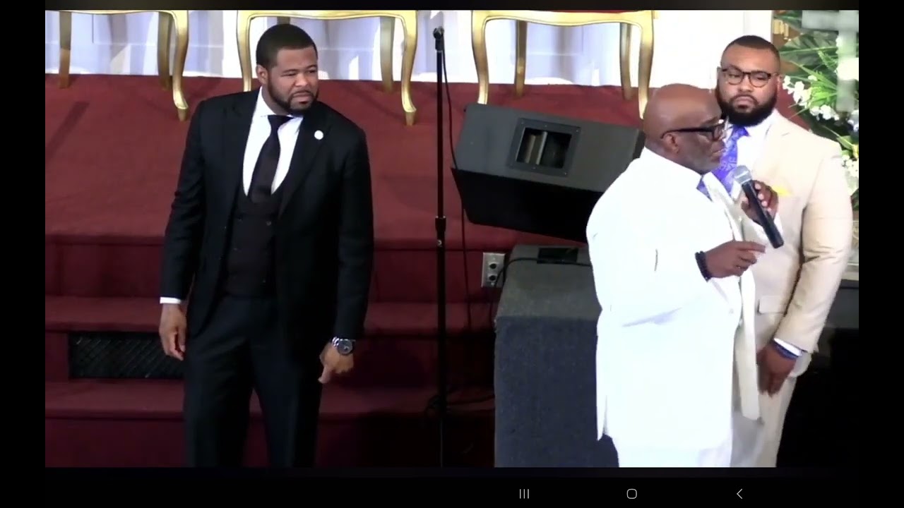 Apostle Joseph Hamilton laying hands on the saints at St John's deliverance temple in Mobile AL,