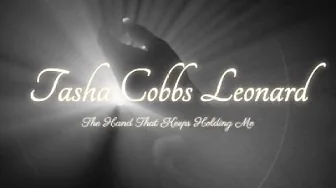 The Hand That Keeps Holding Me - Tasha Cobbs Leonard (Lyrics) The Hand That Keeps Holding Me - Tasha Cobbs Leonard (Lyrics)