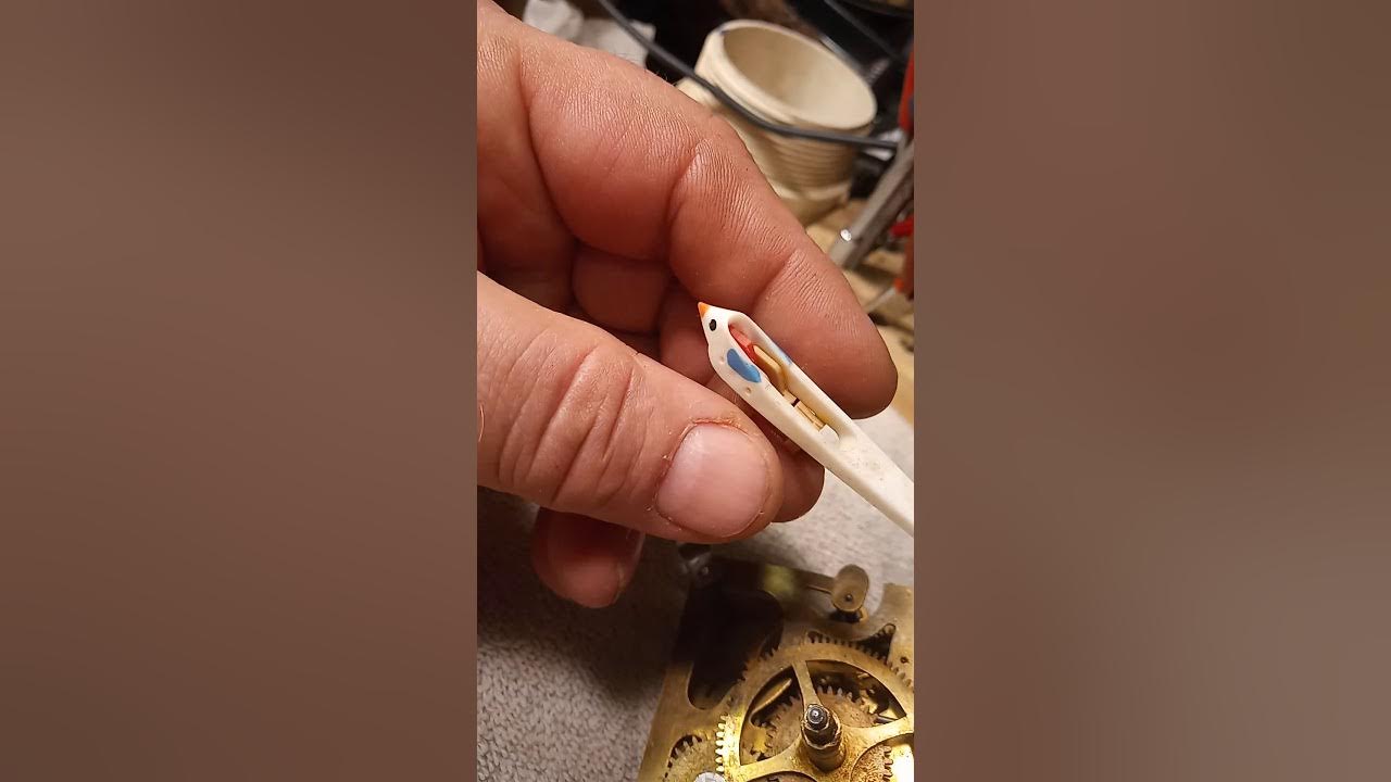 How to replace or mount the cuckoo clock bird onto the mounting post or