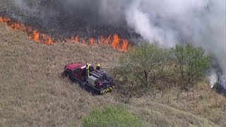 Brush fire dangerously close to homes in Denton County