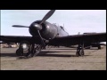Tractor tows Japanese plane at Atsugi Airdrome in Japan. HD Stock Footage