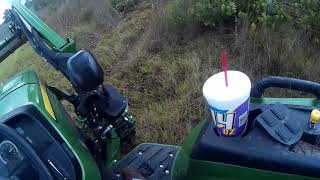 John Deere 4044m bush hogging palmettos brush and saplings