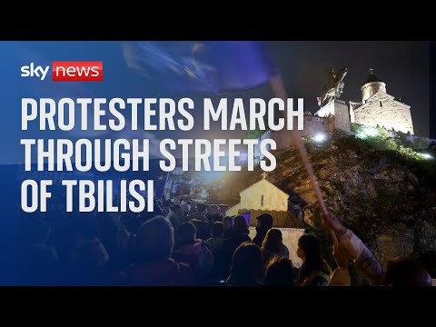 Demonstrators march through Tbilisi, Georgia, in protest over 'foreign agents' bill