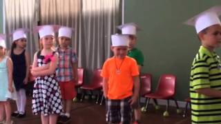Zachary getting his diploma at preschool graduation