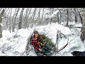 Solo bushcraft winter camping  build warm snow shelter  woodstove inside  snowfall  cowboy coffee
