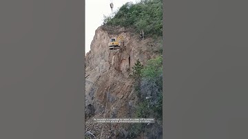 Cliffside Excavation: Clearing Rock Safely on Steep Terrain