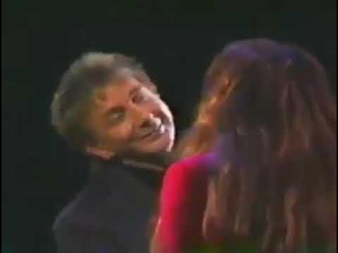 Barry Manilow and Donna Summer performing the song Could it Be Magic