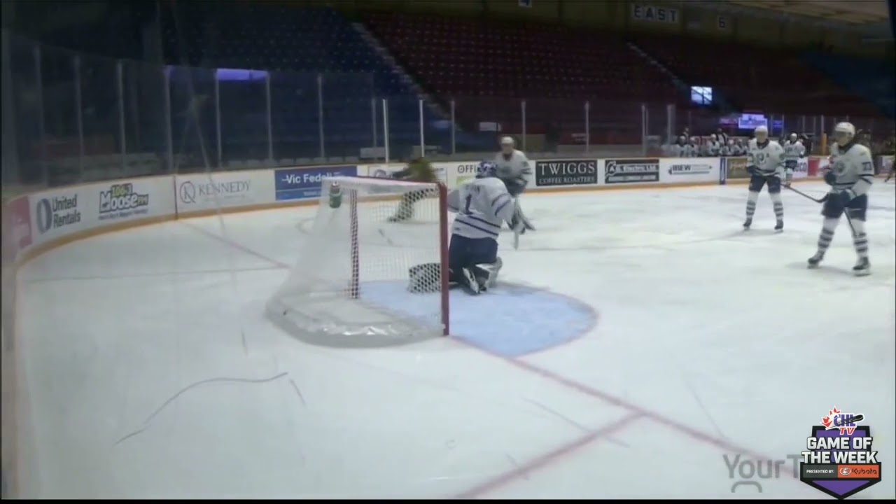Ty Nelson Breaks the puck