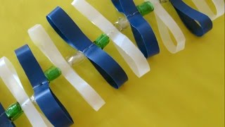 Make a Cool Vertical Plastic Bottle Garland - DIY Home - Guidecentral screenshot 2