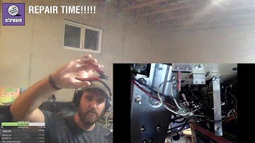 Replacing a broken rollover switch on a pinball machine.