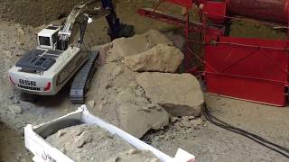 RC excavator Liebherr R956 at work in gravels