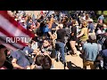 USA: Scuffles break out between opposing protesters at pro-police rally in Albany