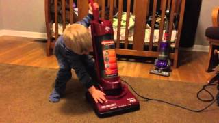 Kid vacuum demonstration with Dirt Devil Dynamite