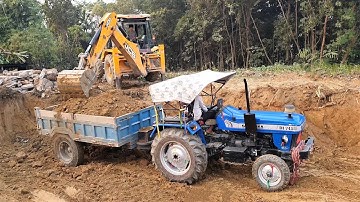 JCB Backhoe Cutting Soil and Loading in Tractor - Backhoe Machine Leveling Agro Field - JCB Video
