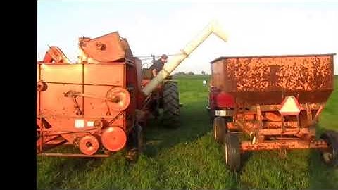 Allis Chalmers All Crop 72 combine and an AC 190XT harvesting spelt