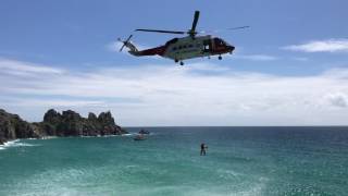 UK Coastguard helicopter approach for cliff rescue captured on film