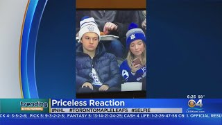 Video of a young toronto maple leafs fan who rolled his eyes after
girlfriend snapped selfie during game is becoming an internet
sensation.