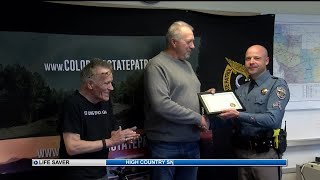 Colorado State Patrol honors truck driver who saved two people from burning car