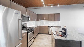 Tour a large one-bedroom plus den at The Lofts at River East in Streeterville