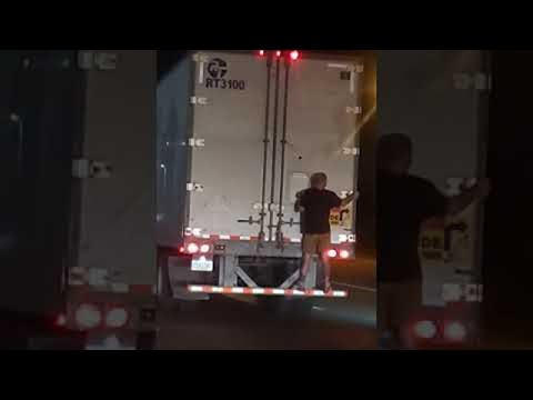 Man Clings to the Back of 18 Wheeler on Freeway || ViralHog
