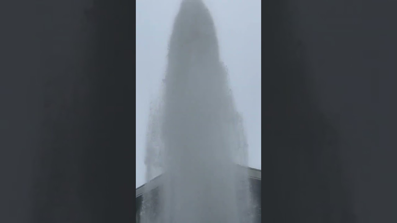 Tall geyser shoots water over multi-story building #Shorts