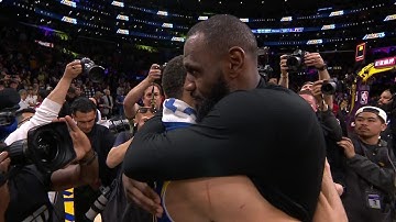 LeBron James & Steph Curry embrace after the Warriors