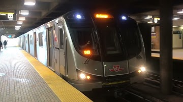 TTC Line 1 subway train arriving and departing Eglinton West Station