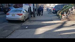 Jersey city police responding to a call about a FedEx truck hit a park car