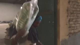 Volunteers Loading Rice to Distribute at the Gurudwara Sikh Temple Saba Charitable Foundation Teaser Mission Video