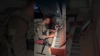 Soldier plays Israel national anthem in destroyed home