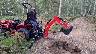 Branson Tractors 2500 digging with a BH100 Tractor Backhoe