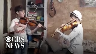 12-year-old twins play violin concert in quarantine