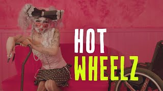 Hot Wheelz is a 'drag creature' in a wheelchair making magic out of their disability