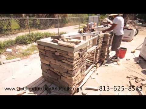 Outdoor Kitchen with Pizza Oven, Cultured Stone, Granite, Fire Place, Fridge, tap, and wine chiller
