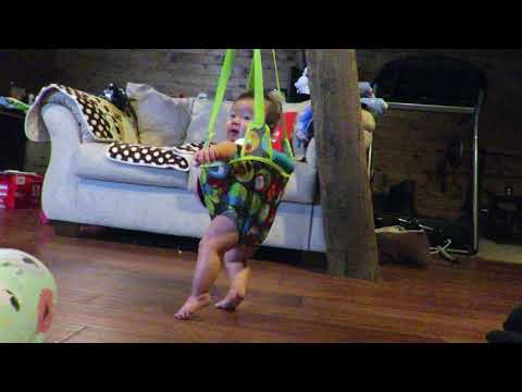 Baby Chloe in the Evenflo ExerSaucer Doorway Jumper at 22 weeks